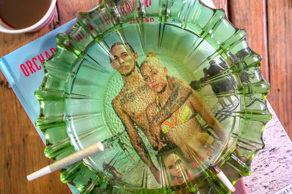 joint in ashtray sitting on magazine